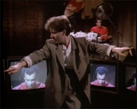 Mel in the background... Mel on the TVs... its very 1984